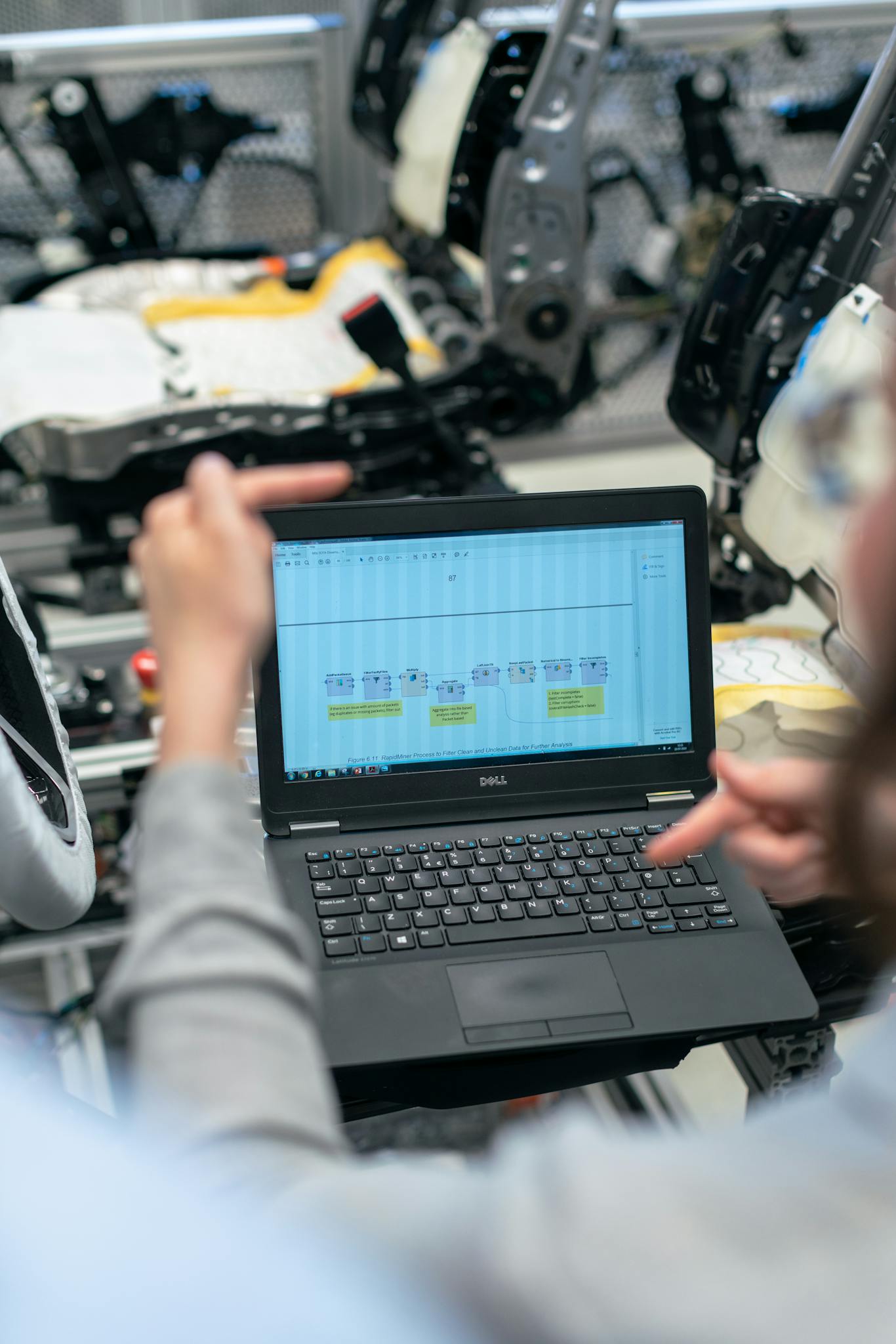 Engineers Using A Laptop To Analyze Software