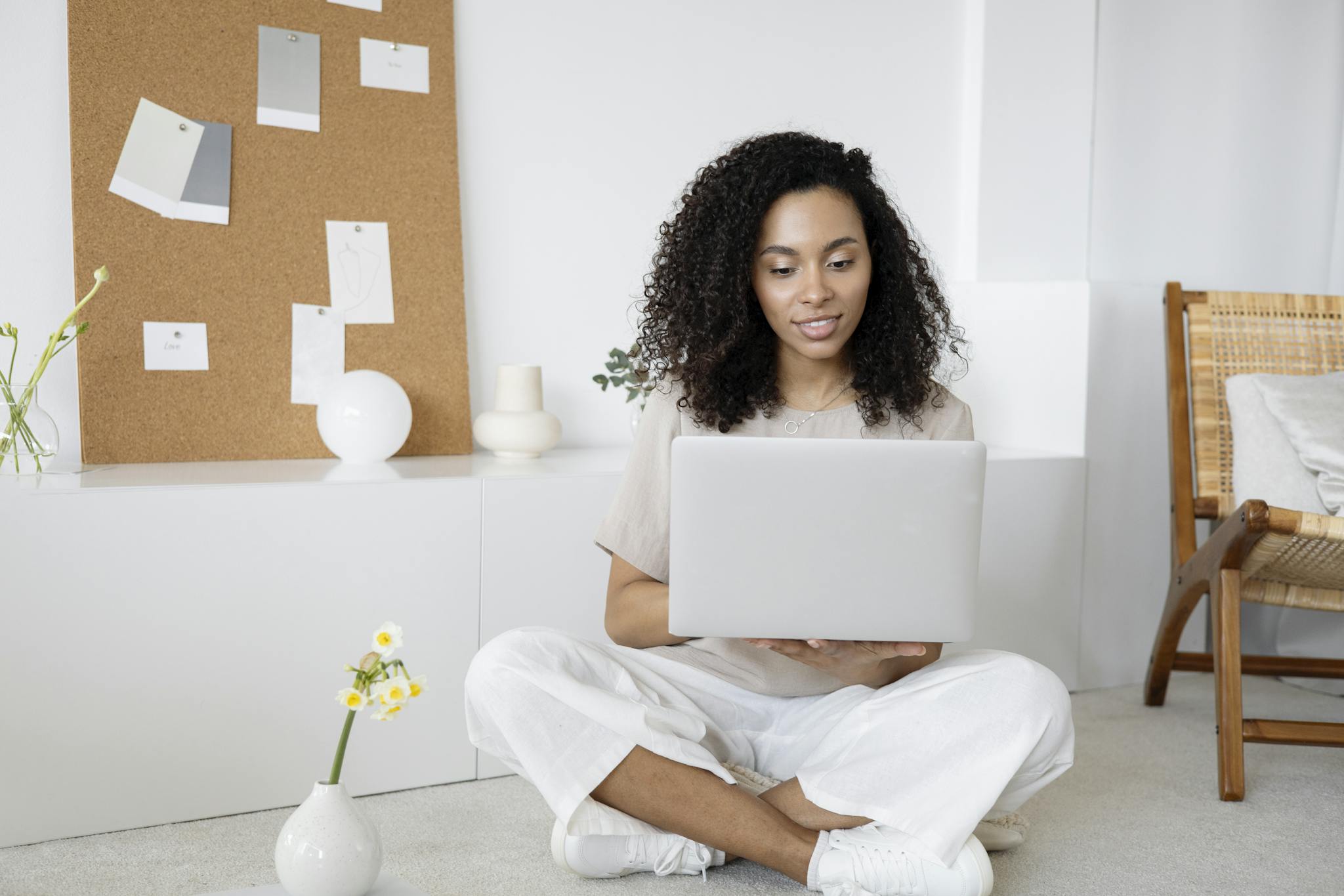 Young Woman With Curly Hair Working On
